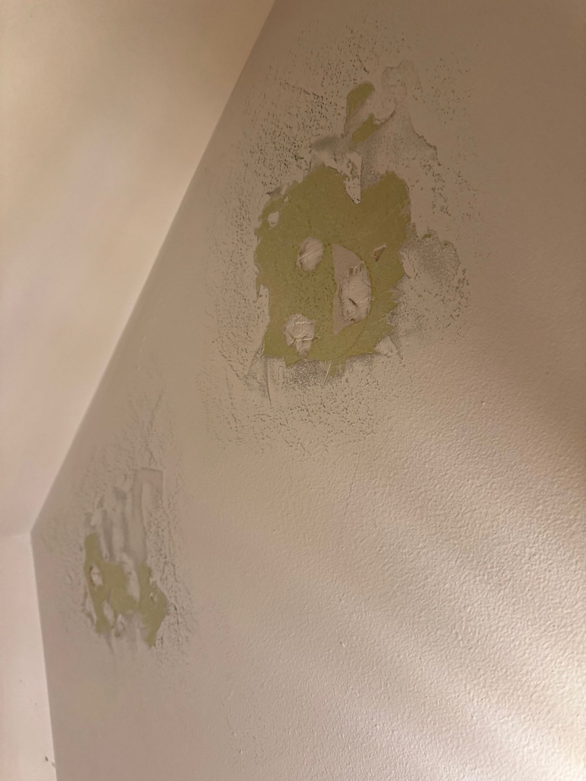 Old wall surface with peeling paint before preparation